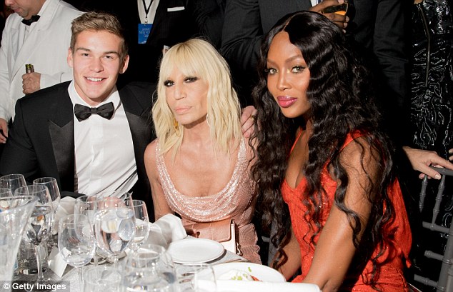 The beautiful people: Model Mitchell Slaggert, Donatella and Naomi all cosied up for a snap 