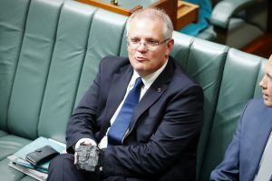 Treasurer Scott Morrison with a lump of coal in question time.