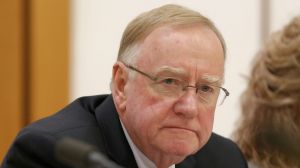 Senator Ian Macdonald listens to response from Solicitor-General Justin Gleeson SC during a public hearing before the ...