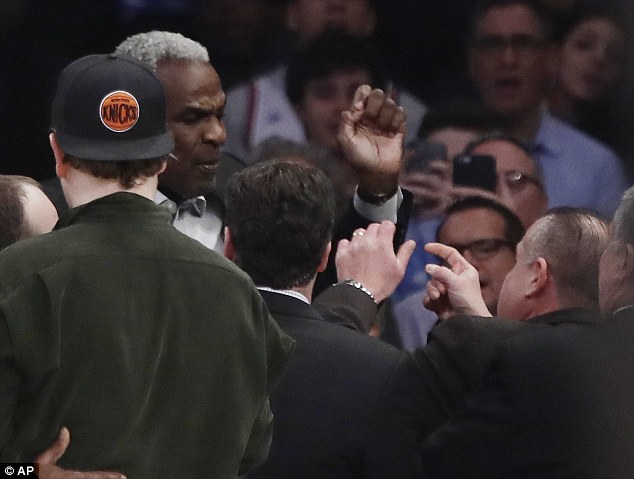 Former Knicks star Charles Oakley was escorted from his seats at Madison Square Garden and arrested after an altercation near team owner James Dolan