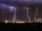 Lightning storm over Melbourne city skyline at night