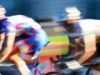 Colourful blurred closeup shot of two racing cyclists 