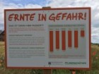 A side by a roadside farming plot near Germany promoting the need for modern farming techniques