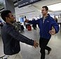 Army Capt. Matthew Ball, right, prepares to hug his former interpreter Qismat Amin, as Amin arrives from Afghanistan, at San Francisco International Airport Wednesday, Feb. 8, 2017, in San Francisco. Ball welcomed Amin to the United States after buying him a plane ticket to ensure he would get in quickly amid concerns the Trump administration may expand its travel ban to Afghanistan. (AP Photo/Marcio Jose Sanchez)