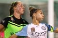 Steph Catley of Melbourne City and Celeste Boureille of Canberra compete for the ball.