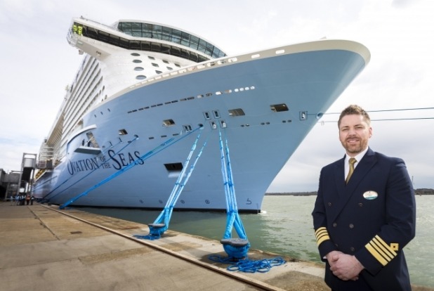 Captain Henrik Loy stands in front of Ovation of the Seas where he will serve as Captain.