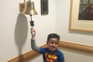 Six-year-old Jimmy rings the bell at the end of 12 months of chemotherapy.