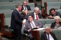 Deputy Prime Minister Barnaby Joyce speaks with George Christensen during question time at Parliament House in Canberra ...