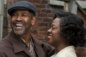 Imperfect hero: Denzel Washington as Troy, the trash man who is a tyrant in his own castle, with Viola Davis as his ...