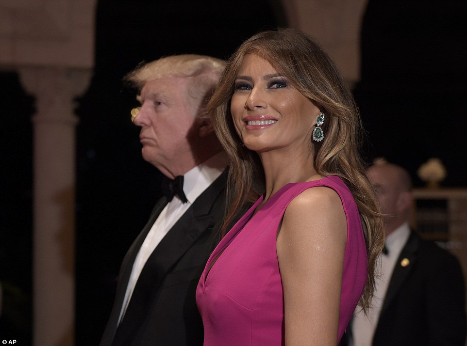 First Lady Melania Trump looked unfazed by the unfolding political drama as she stood by her husband's side and beamed while attending the ritzy gala 