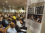 FILE - In this Aug. 19, 2014, file photo, a poster reads "We Will Remember Ezell Ford" at Paradise Baptist Church during a community forum in Los Angeles, to discuss the police shooting of 25-year-old Ezell Ford. The city of Los Angeles will pay $1.5 million to settle a lawsuit brought by the family of  Ford,  who was killed by police during a struggle over an officer's gun. The settlement was approved Wednesday, Feb. 8, 2017, by the Los Angeles City Council after Ezell Ford's family brought a civil rights lawsuit against the city. (AP Photo/Ringo H.W. Chiu, File)