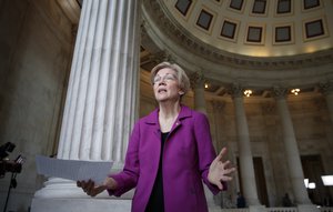 Holding a transcript of her speech in the Senate Chamber, Democratic Sen. Elizabeth Warren of Massachusetts reacts to being rebuked by the Senate leadership and accused of impugning a fellow senator, Sen. Jeff Sessions, R-Ala., the attorney general nominee, on Capitol Hill in Washington, Wednesday, Feb. 8, 2017.