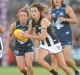 More than 40,000 packed Ikon Park to watch Carlton and Collingwood women kick-off the season.