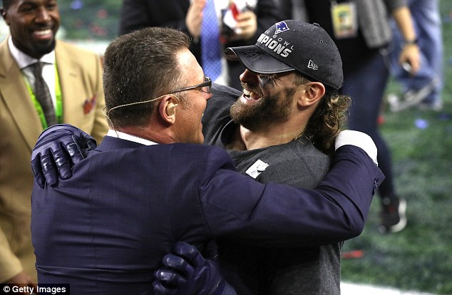 Chris Long is seen hugging his father, Hall of Famer and NFL host Howie Long, after Sunday's Super Bowl