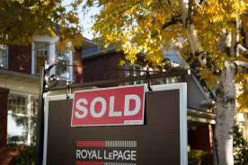 A real estate sold sign hangs in front of a west-end Toronto. Variable-rate mortgages are getting cheaper and more appealing, especially for buyers in high-priced areas like Toronto.