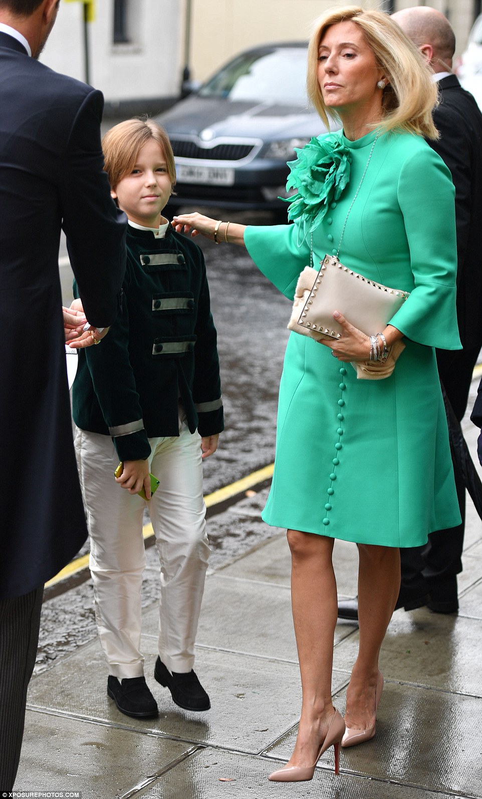 Princess Marie Chantal of Greece ushers her youngest son Aristidis-Stavros into the church 