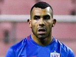 Carlos Tevez (left) and his Shanghai Shenhua team-mates were beaten by Brisbane Roar