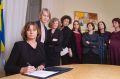 Sweden's Deputy Prime Minister Isabella Lovin, left, signs a proposal for the Scandinavian country's new climate law in ...