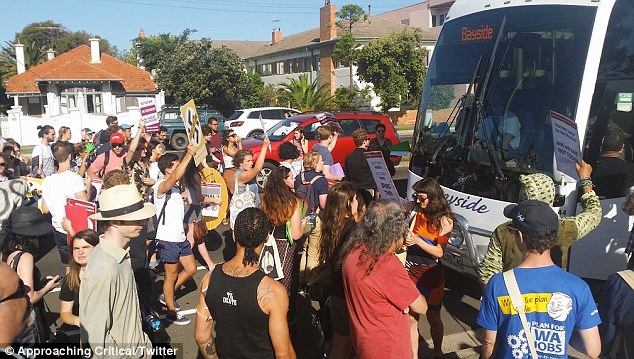 Many protesters waved signs in front of the bus, with messages including 'Fascist free zone'