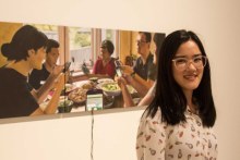 Sarah Boon with her painting, Group Chat (ABC Radio Perth: Emma Wynne)