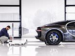 Dream car factory: The facility has a floor space of more than 1,000 square metres and has a unique reflective glossy white floor that 'creates an atmosphere comparable with the catwalk of a fashion house', Bugatti says