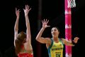 Helen Housby shoots past Sharni Layton.