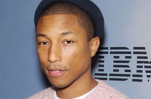 Pharrell Williams says he's happy to be the guy behind the scenes.