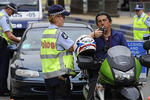 Man on motorcycle at RBT stop (Julian Smith: AAP)