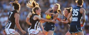 MELBOURNE, AUSTRALIA - FEBRUARY 03: Alicia Eva of the Magpies lays a tackle during the AFL Women's round 1 match between ...