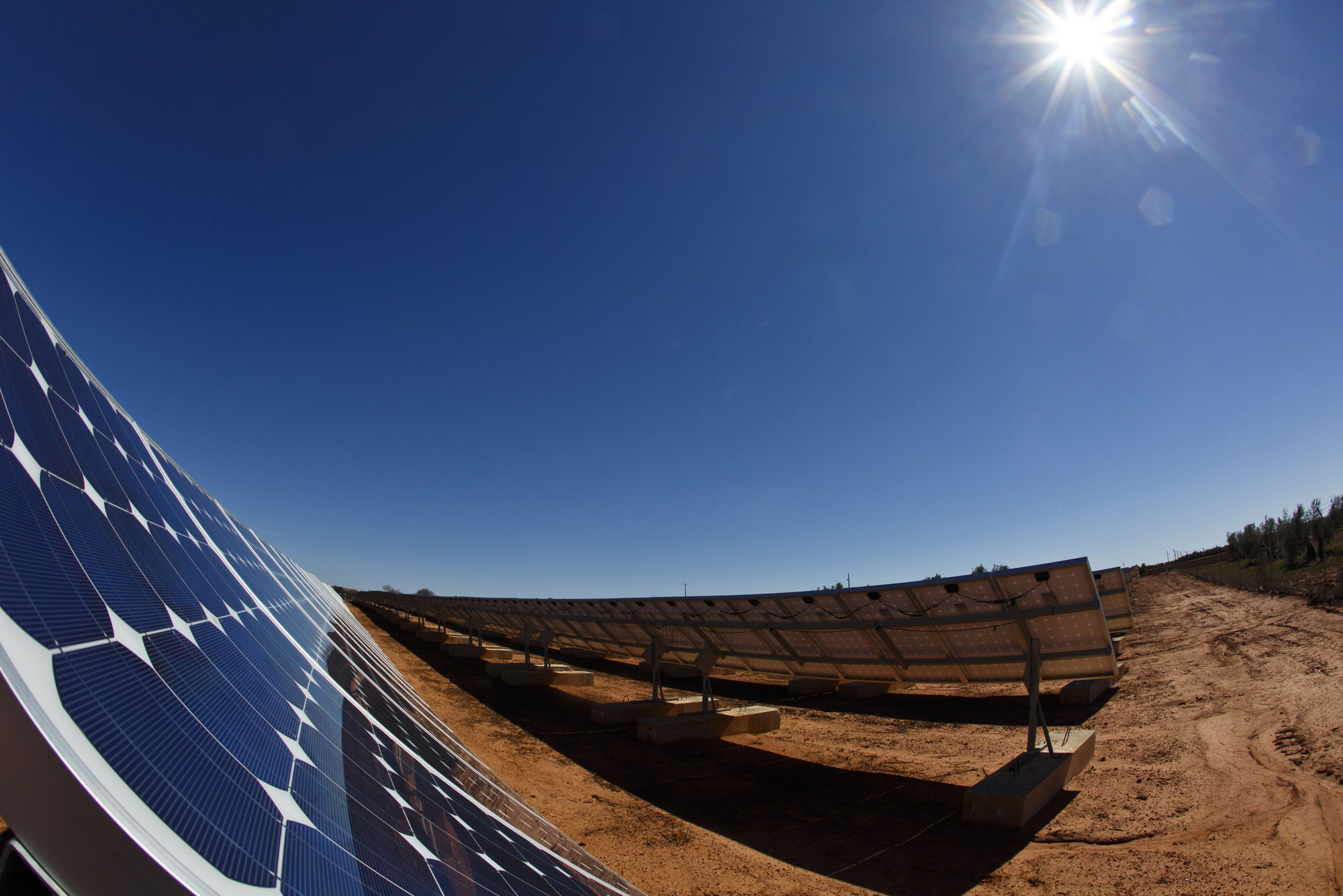 Solar panels stand at a solar power plant operated by Ingeneieria y Electricidad Rodriguez SL in Villanueva de los Infantes, Spain, on Monday, March, 10, 2014. Iberdrola SA estimates reduced support by the Spanish government will cost renewable power generators, such as itself and Acciona, 3.96 billion euros ($5.41 billion), with wind and biomass the most affected. Photographer: Angel Navarrete/Bloomberg