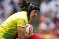 Keen for the 15-a-side: Sharni Williams is tackled during the Sydney Sevens.