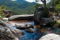 Luke Clarke of Calwell cools off in the rock pools at Gibraltar Falls during hot weather.