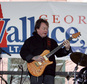 FILE - In this Feb. 18, 2006 file photo, Rick Derringer performs during a campaign rally kicking off George Wallace Jr's bid for the office of lieutenant governor in Montgomery, Ala.  Prosecutors say  Derringer carried a loaded gun in his carry-on bag on a Delta Air Lines flight from Cancun, Mexico, but was stopped after landing in Atlanta.  Derringer was charged with unlawfully entering an airport¿s secure area Jan. 9, 2017. His representatives didn¿t immediately return multiple calls and emails.  (AP Photo/Rob Carr)