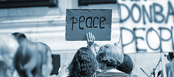 Protestors holding "Peace" sign