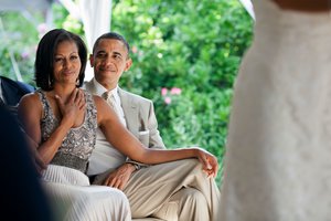 President Barack Obama, First Lady Michelle Obama, daughters Malia and Sasha, and Marian Robinson attend the wedding of Laura Jarrett to Tony Balkissoon at the home of Senior Advisor Valerie Jarrett in the Kenwood neighborhood of Chicago, Illinois, June 16, 2012.