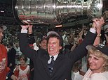 FILE - In this June 17. 1998, file photo, Detroit Red Wings owner Mike Ilitch, center, hoists the Stanley Cup in Washington after the Red Wings won their second consecutive NHL championship. Igor Larionov is at left. Ilitch, founder of the Little Caesars Pizza empire and owner of the Red Wings and the Detroit Tigers, has died. He was 87. Ilitch, who was praised for keeping his professional hockey and baseball teams in Detroit as other urban sports franchises relocated to new suburban stadiums, died Friday, Feb. 10, 2017, at a hospital in Detroit, according to family spokesman Doug Kuiper. (Julian H. Gonzalez/Detroit Free Press via AP)