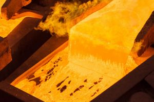 Molten copper pours into an anode casting wheel at the Aurubis AG metals plant in Hamburg, Germany.