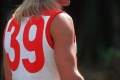 Former AFL player Warwick Capper with both a mullet and DIY bleach. 