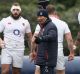 Carrot and stick: Eddie Jones looks on during an England training session at Pennyhill Park.