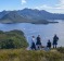 Guide Peter Marmion (L) with tourists from the Odalisque on top of Balmoral Hill, Port Davey.