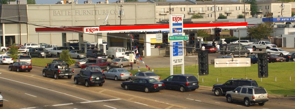 Vehicles form a line at an Exxon gas station off of Interstate 55 in Jackson, Miss., Tuesday, Aug. 30, 2005. The station was one of the few in the city with both power and gas one day after Hurricane Katrina made landfall. (AP Photo/The Calrion Ledger, Rick Guy)
