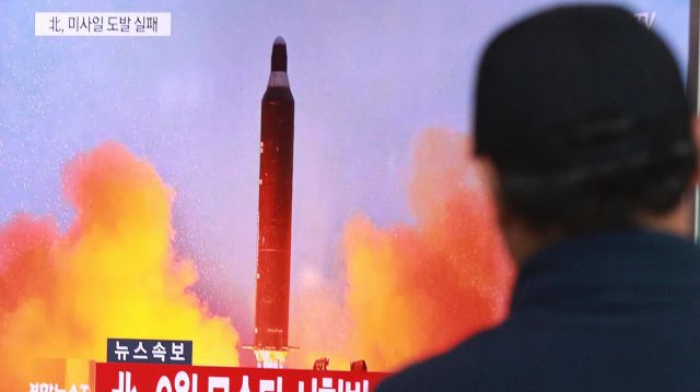 A man watches a TV news program on North Korea's missile launches at  Seoul Railway Station, South Korea, at the time of ...