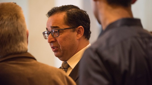 Slater & Gordon CEO Andrew Grech talks to investors after the company's AGM in Melbourne. Photo by Jesse Marlow. .