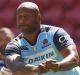 Lote Tuqiri, of the Waratahs, passes during the Rugby Global Tens match between Waratahs and Rebels at Suncorp Stadium. 