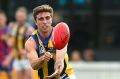 Dylan Weickhardt of Sandringham handballs during the VFL elimination final match between Port Melbourne and Sandringham.