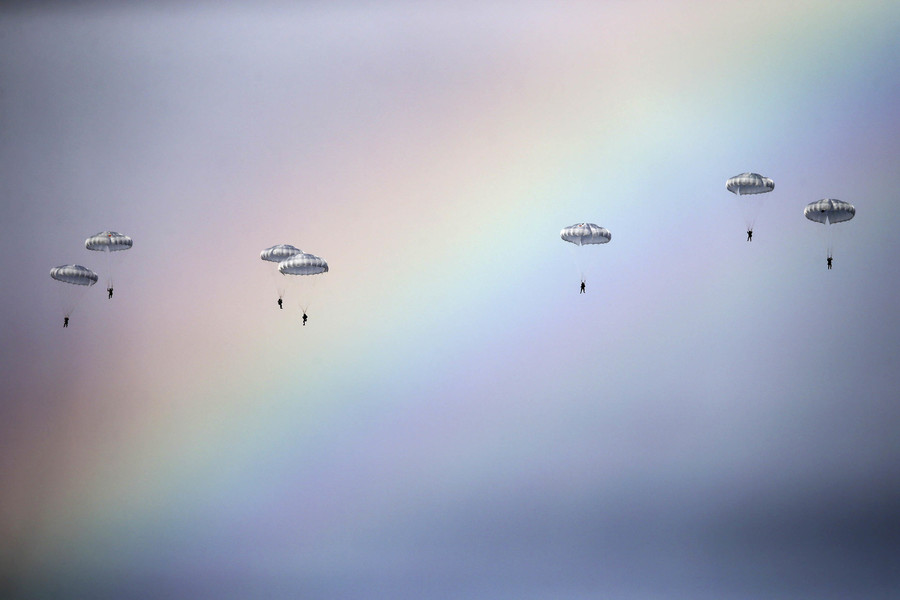 Russian paratroopers jump past a rainbow during a joint Serbian-Russian military training exercise &quot;Slavic Brotherhood&quot; in the town of Kovin, near Belgrade, Serbia. (Marko Djurica, Reuters)     