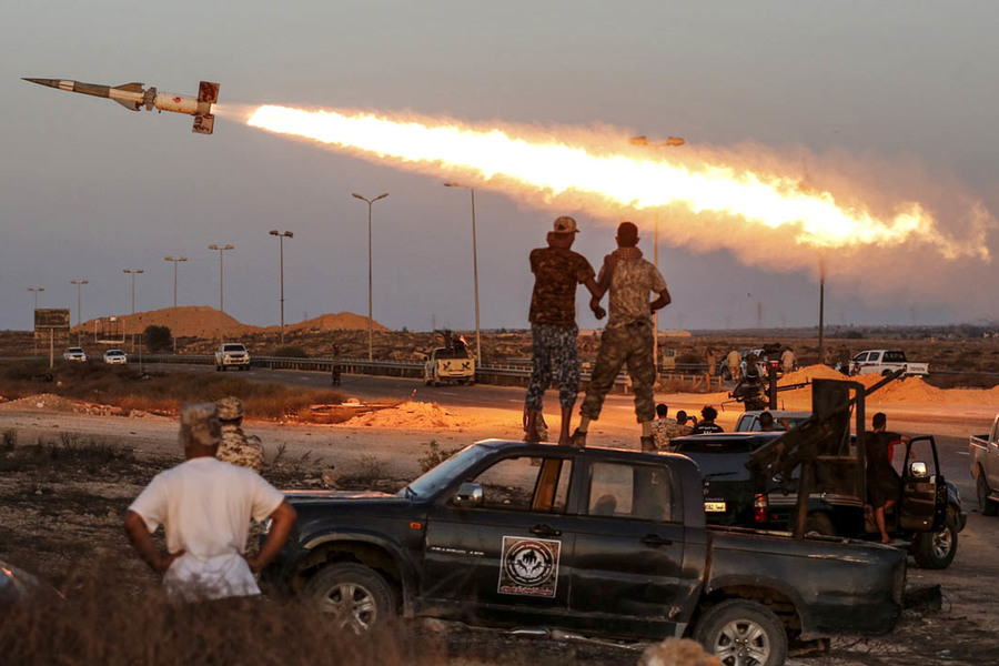 Fighters of Libyan forces allied with the UN-backed government fire a rocket at Islamic State fighters in Sirte, Libya, on August 4  2016. (Goran Tomasevic, Reuters)