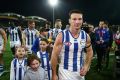 Games-record holder Brent Harvey leaves the field for the last time as a Kangaroo and possibly as an AFL footballer.