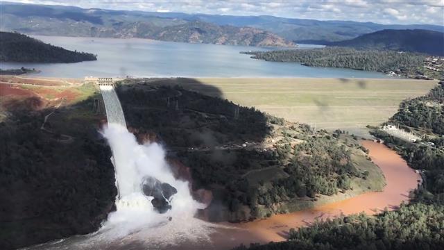 Tens of thousands of people living in the downstream area of Oroville Dam, in northern California, have been ordered to evacuate after an auxiliary spillway appeared in danger of failure. Photo: Josh F.W. Cook/Office of Assemblyman Brian Dahle/AP