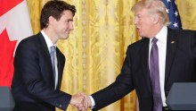 President Donald Trump (right) and Canadian Prime Minister Justin Trudeau (left) shake hands